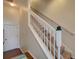 Staircase with white railings leading to the upper level at 535 Crimson Ln, Winter Springs, FL 32708