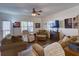 Spacious living room with hardwood floors, comfortable seating, and fireplace at 535 Crimson Ln, Winter Springs, FL 32708