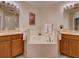Large bathroom with a corner bathtub and double vanity at 535 Crimson Ln, Winter Springs, FL 32708