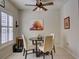 Cozy breakfast nook with a round table and four chairs, near a window at 535 Crimson Ln, Winter Springs, FL 32708