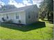 House exterior with well-maintained landscaping at 512 W Ella J Gilmore St, Apopka, FL 32703