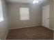 Bright bedroom with neutral walls and carpet flooring at 512 W Ella J Gilmore St, Apopka, FL 32703