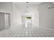 Open living room with tile floors and pool view at 5418 S Bracken Ct, Winter Park, FL 32792