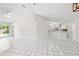 Bright living room with tile floors and sliding doors leading to a pool at 5418 S Bracken Ct, Winter Park, FL 32792