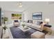 Living room with comfy seating and large TV at 5418 S Bracken Ct, Winter Park, FL 32792