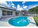 Inviting kidney-shaped pool with tiled accents at 5418 S Bracken Ct, Winter Park, FL 32792