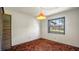 Bright bedroom featuring a window and brown carpet at 1435 June Ct, Deltona, FL 32725