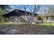 House back exterior with screened patio and yard at 1435 June Ct, Deltona, FL 32725