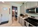 Modern kitchen with stainless steel appliances and pantry at 9513 Amber Chestnut Way, Winter Garden, FL 34787