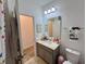 Clean bathroom with vanity, toilet, and shower/tub combo at 9513 Amber Chestnut Way, Winter Garden, FL 34787