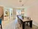 Elegant dining room features a large table and modern lighting at 9513 Amber Chestnut Way, Winter Garden, FL 34787