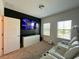 Home theater with large screen TV and comfy seating at 9513 Amber Chestnut Way, Winter Garden, FL 34787