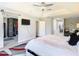 Spacious bedroom with a large bed, built-in closet, and hardwood floors at 10542 Wittenberg Way, Orlando, FL 32832