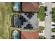 Aerial view of house with solar panels and pool at 348 Sand Ridge Dr, Davenport, FL 33896