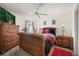 Bedroom with sleigh bed, dresser, and ceiling fan at 348 Sand Ridge Dr, Davenport, FL 33896