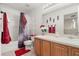Bathroom with shower/tub combo and wood cabinets at 348 Sand Ridge Dr, Davenport, FL 33896