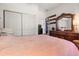 Spacious bedroom with a large bed and dresser at 348 Sand Ridge Dr, Davenport, FL 33896