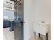 Laundry room with utility sink and separate access at 3623 Weatherfield Dr, Kissimmee, FL 34746