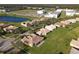 Aerial view of neighborhood with large school nearby at 3623 Weatherfield Dr, Kissimmee, FL 34746