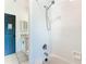 Clean bathroom with a shower and tub, white tile, and updated fixtures at 3623 Weatherfield Dr, Kissimmee, FL 34746