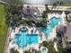 Aerial view of resort-style pool and clubhouse with water features at 3623 Weatherfield Dr, Kissimmee, FL 34746