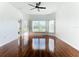 Spacious living room featuring hardwood floors and a view of the backyard at 3623 Weatherfield Dr, Kissimmee, FL 34746
