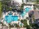 Aerial view of resort-style pool and clubhouse with water features at 3623 Weatherfield Dr, Kissimmee, FL 34746
