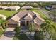 Single-Gathering home with tile roof and palm trees in a residential neighborhood at 3623 Weatherfield Dr, Kissimmee, FL 34746