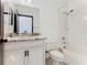 Clean bathroom with shower/tub combo, granite vanity, and white cabinets at 3623 Weatherfield Dr, Kissimmee, FL 34746