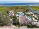 Aerial view of resort-style pool and clubhouse with water features at 3623 Weatherfield Dr, Kissimmee, FL 34746