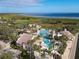 Aerial view of resort-style pool and clubhouse with water features at 3623 Weatherfield Dr, Kissimmee, FL 34746