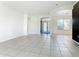 Spacious living room with tile flooring and access to the backyard at 3623 Weatherfield Dr, Kissimmee, FL 34746