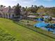 Community playground with play structures, picnic tables, and grassy areas at 3623 Weatherfield Dr, Kissimmee, FL 34746