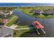 Aerial view of waterfront community with boat docks and walking paths at 3623 Weatherfield Dr, Kissimmee, FL 34746