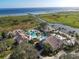 Aerial view of resort-style pool and clubhouse with water features at 3623 Weatherfield Dr, Kissimmee, FL 34746