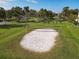 Sand volleyball court situated in a grassy area with palm trees at 3623 Weatherfield Dr, Kissimmee, FL 34746