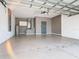 Spacious garage with painted floor, cabinets, and extra storage at 3623 Weatherfield Dr, Kissimmee, FL 34746