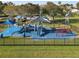 Playground with multiple slides, climbing structures, and shade canopies at 3623 Weatherfield Dr, Kissimmee, FL 34746