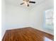 Well-lit bedroom with hardwood floors and a window at 3623 Weatherfield Dr, Kissimmee, FL 34746