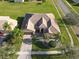 House with tile roof, landscaping, and driveway, viewed from above at 3623 Weatherfield Dr, Kissimmee, FL 34746