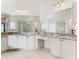 Spacious Primary bathroom, featuring double vanity, granite counters, and a large shower at 3623 Weatherfield Dr, Kissimmee, FL 34746