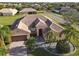 Property view showcasing home's tile roof and landscaping at 3623 Weatherfield Dr, Kissimmee, FL 34746
