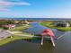 Aerial view of waterfront community with boat docks and walking paths at 3623 Weatherfield Dr, Kissimmee, FL 34746