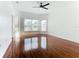 Bright living room with hardwood floors and large windows at 3623 Weatherfield Dr, Kissimmee, FL 34746