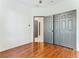 Bedroom with double door closet and wood floors at 3623 Weatherfield Dr, Kissimmee, FL 34746