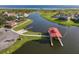 Aerial view of waterfront community with boat docks and walking paths at 3623 Weatherfield Dr, Kissimmee, FL 34746