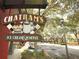 Chatham's Ice Cream & Coffee shop sign with golf carts nearby at 4245 Arlington Ridge Blvd, Leesburg, FL 34748