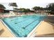Resort-style pool with ample lounge chairs and umbrellas at 4245 Arlington Ridge Blvd, Leesburg, FL 34748