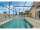 Relaxing screened-in pool and patio area at 1113 Casterton Cir, Davenport, FL 33897