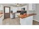 Modern kitchen with butcher block countertops and stainless steel appliances at 1701 Minnesota Ave, Saint Cloud, FL 34769